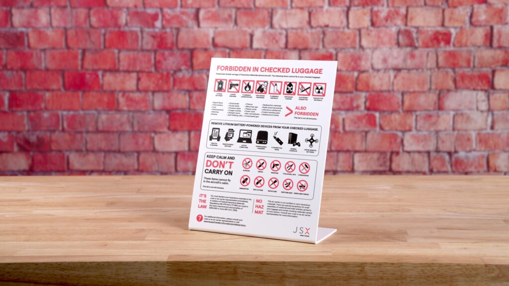 Full-color safety graphic printed on a slant-back sign holder