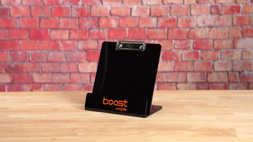 Boost Mobile logo printed on a black acrylic clipboard